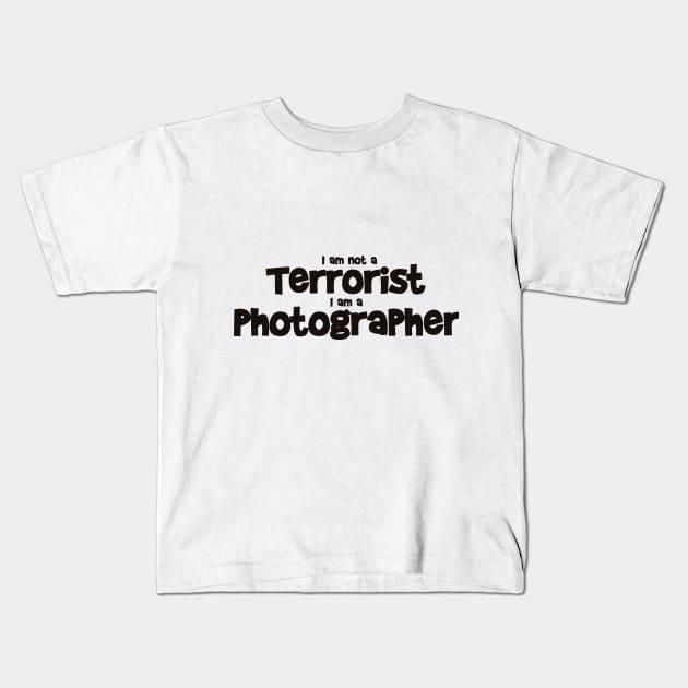 Terrorist Photographer Kids T-Shirt by martybugs